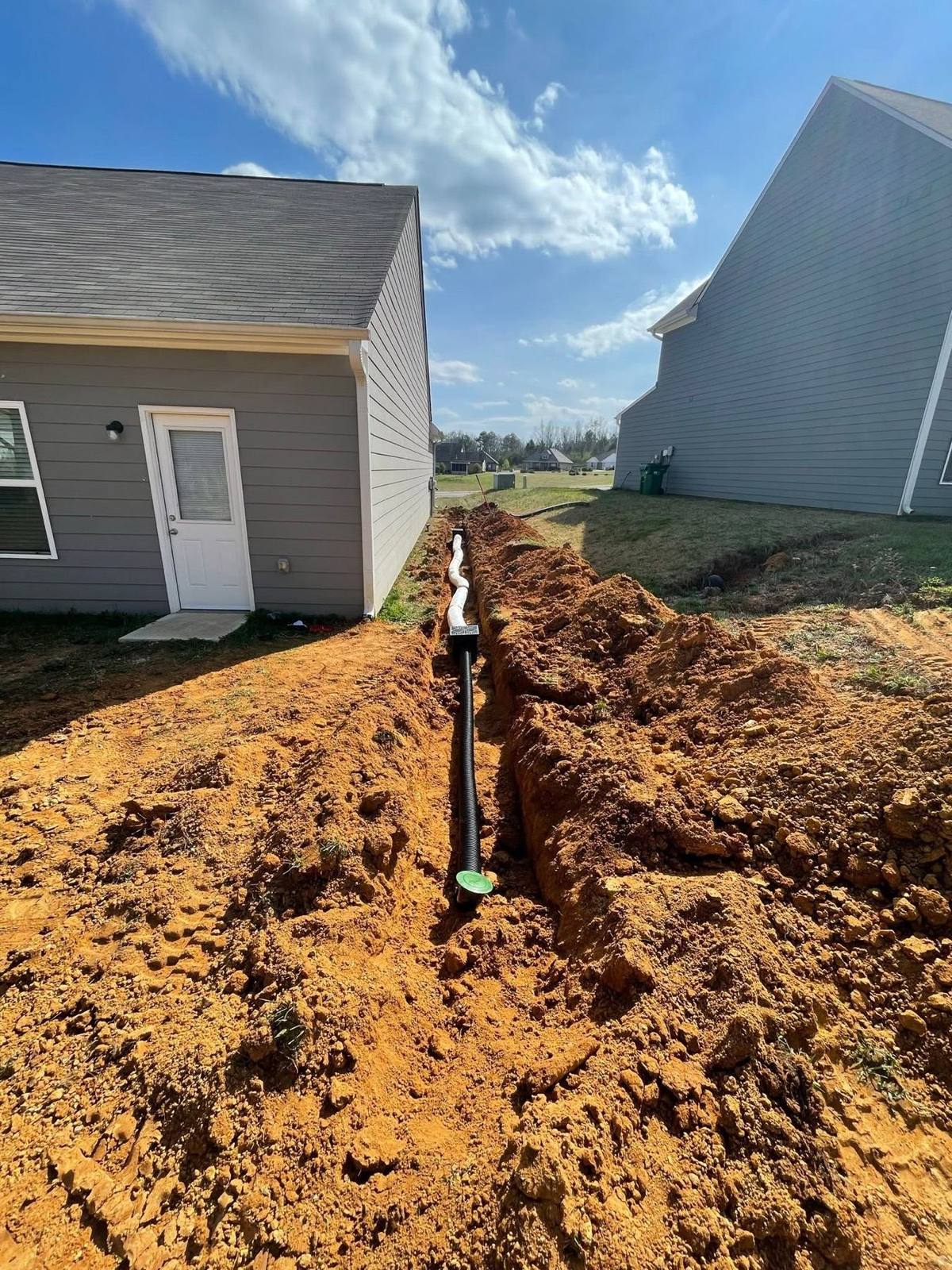 Drainage trench beside a home
